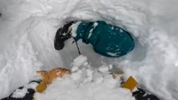 A snowboarder got buried upside down in snow See skiers