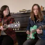 Rebecca and Rachael Wolff play songs together at their family home Canton, Mass. (Robin Lubbock/WBUR)