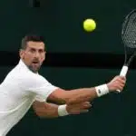 Novak Djokovic returns a shot during his match against Holger Rune.