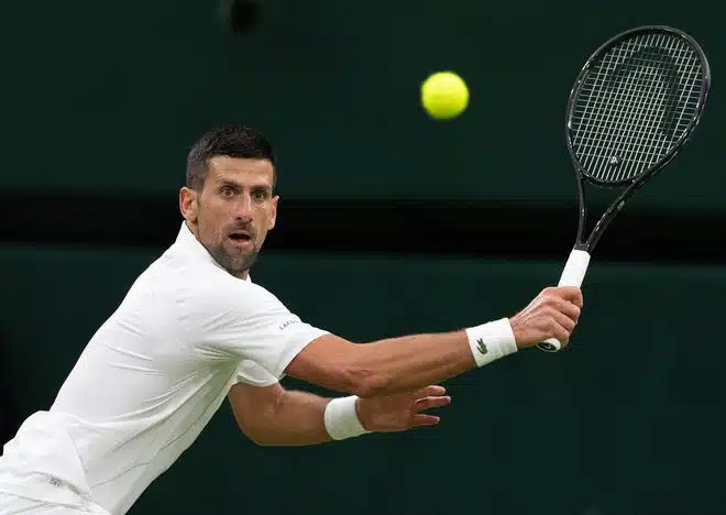 Novak Djokovic returns a shot during his match against Holger Rune.