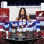 Kai Trump, 17, stands with her dad Donald Trump Jr., son of former U.S. President Donald Trump on stage on the third day of the Republican National Convention at the Fiserv Forum on July 17, 2024 in Milwaukee, Wisconsin.