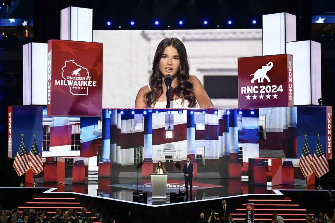 Kai Trump, 17, stands with her dad Donald Trump Jr., son of former U.S. President Donald Trump on stage on the third day of the Republican National Convention at the Fiserv Forum on July 17, 2024 in Milwaukee, Wisconsin.