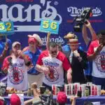 Patrick Bertoletti won the men's contest after chomping on 58 hot dogs and buns.