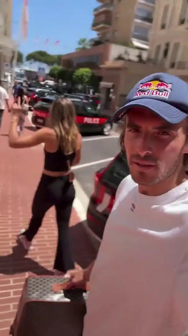 Tsitsipas is stony-faced as he insists that his tennis star girlfriend Badosa carries her luggage while they walk at a frenetic pace while she gives a single digit response